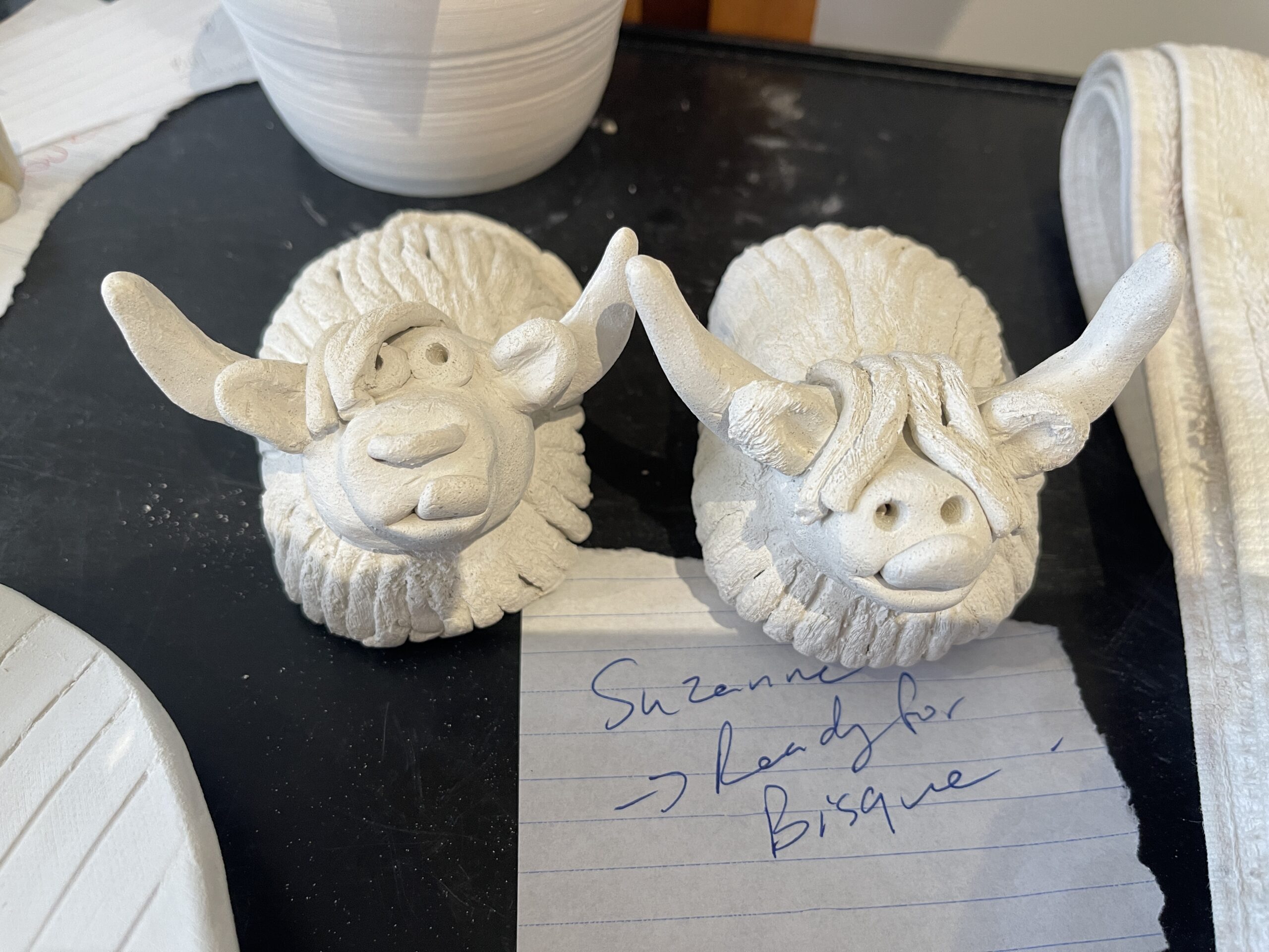 Clay Highland cows in progress on the workshop table