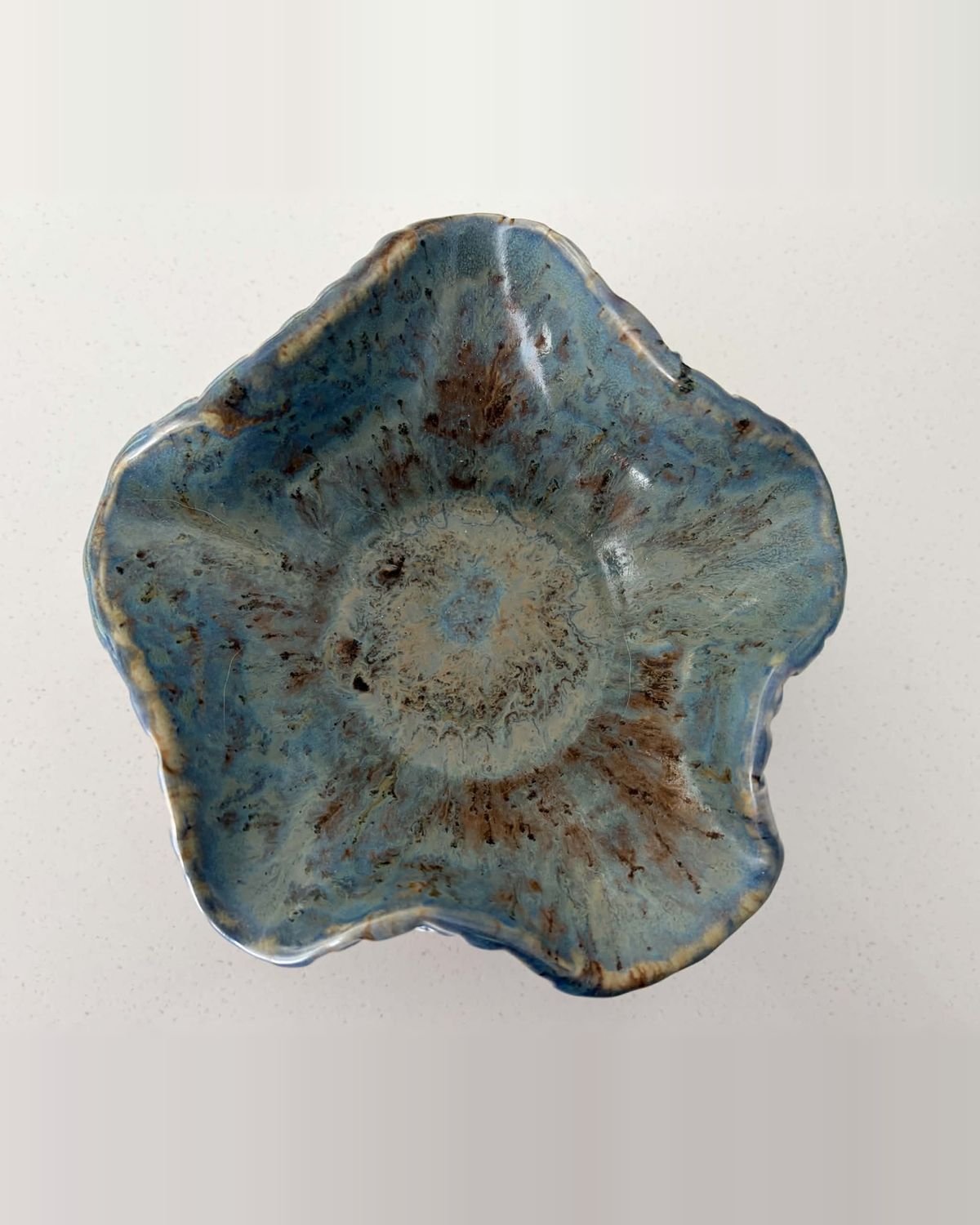 Five-petalled flower-shaped bowl in speckled blue glaze